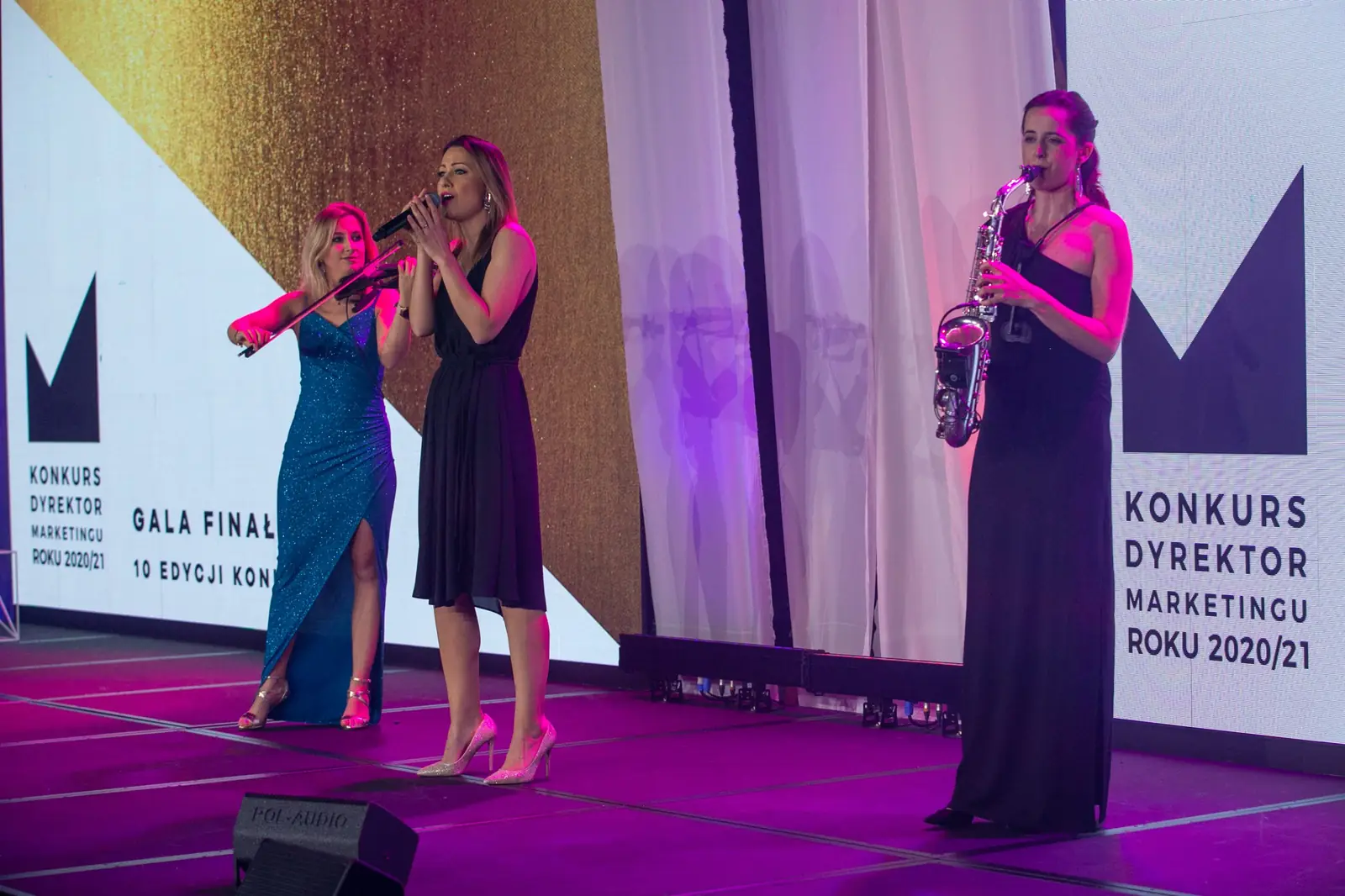 Music trio of violinist, singer and saxophonist performs on the gala stage — DMR Gala X (2021)