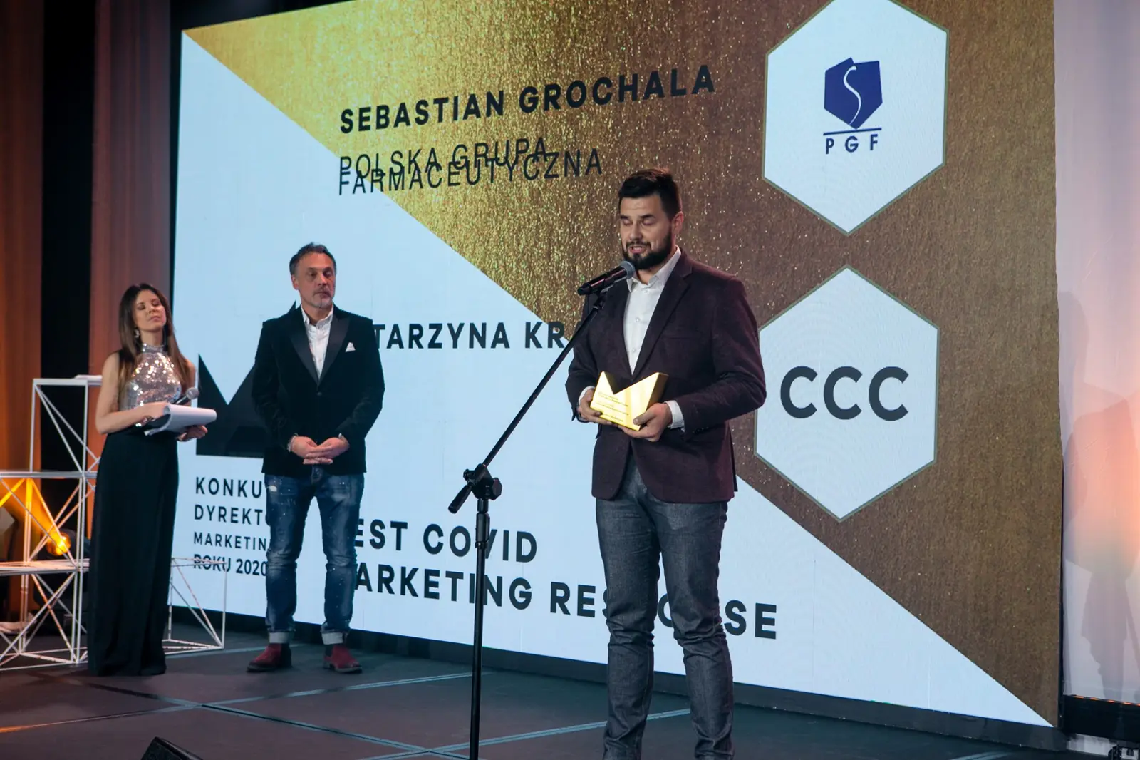 Wide shot: a bearded winner speaks in the Best Covid Marketing Response category — DMR Gala X (2021)