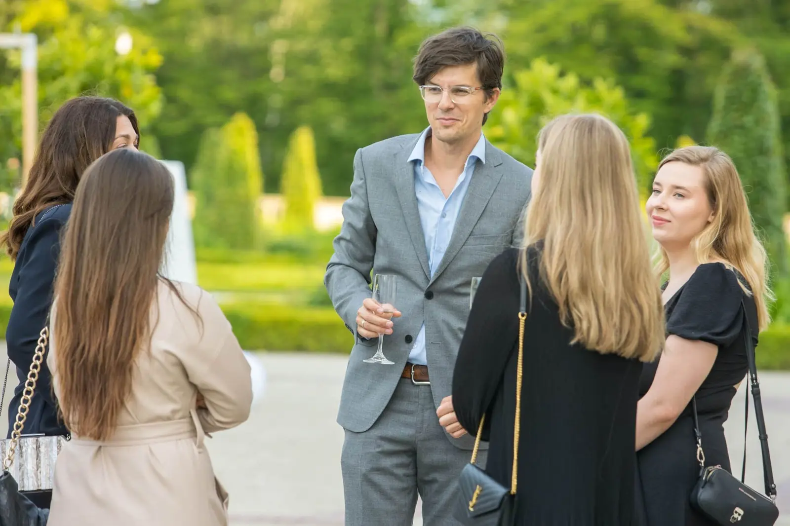 Participants networking in the garden