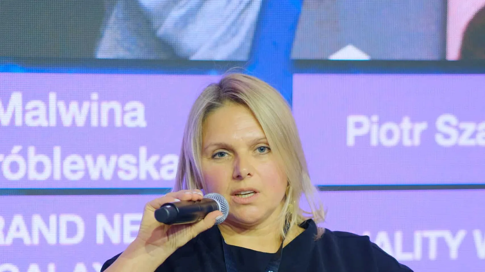 A speaker giving a talk at the AI Marketing Executive Summit 2023