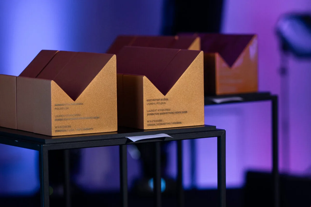 Gold Marketing Director of the Year statuettes with the “M” mark on black stands
